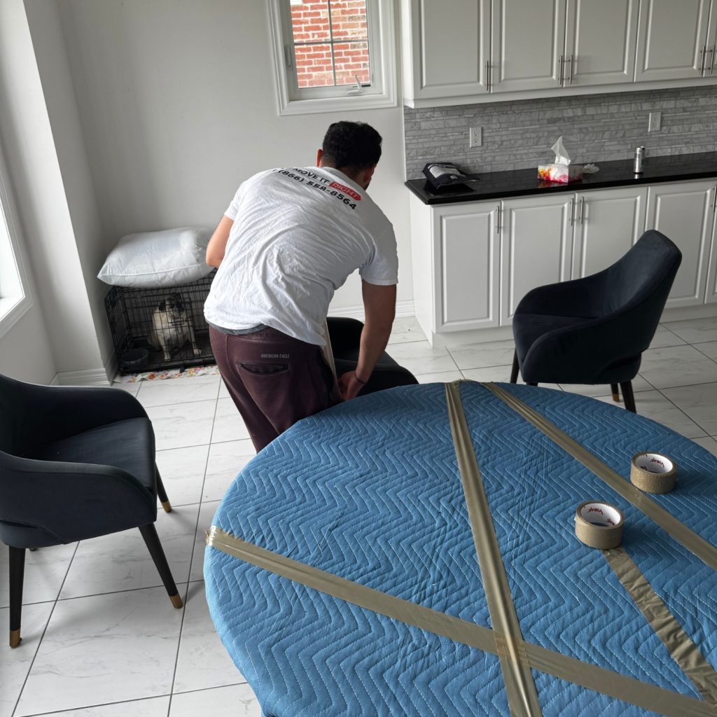 mover wrapping kitchen furniture for moving