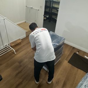 professional mover wrapping furniture