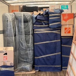 packed furniture in boxes in a truck