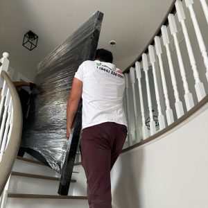 furniture movers going up the stairs