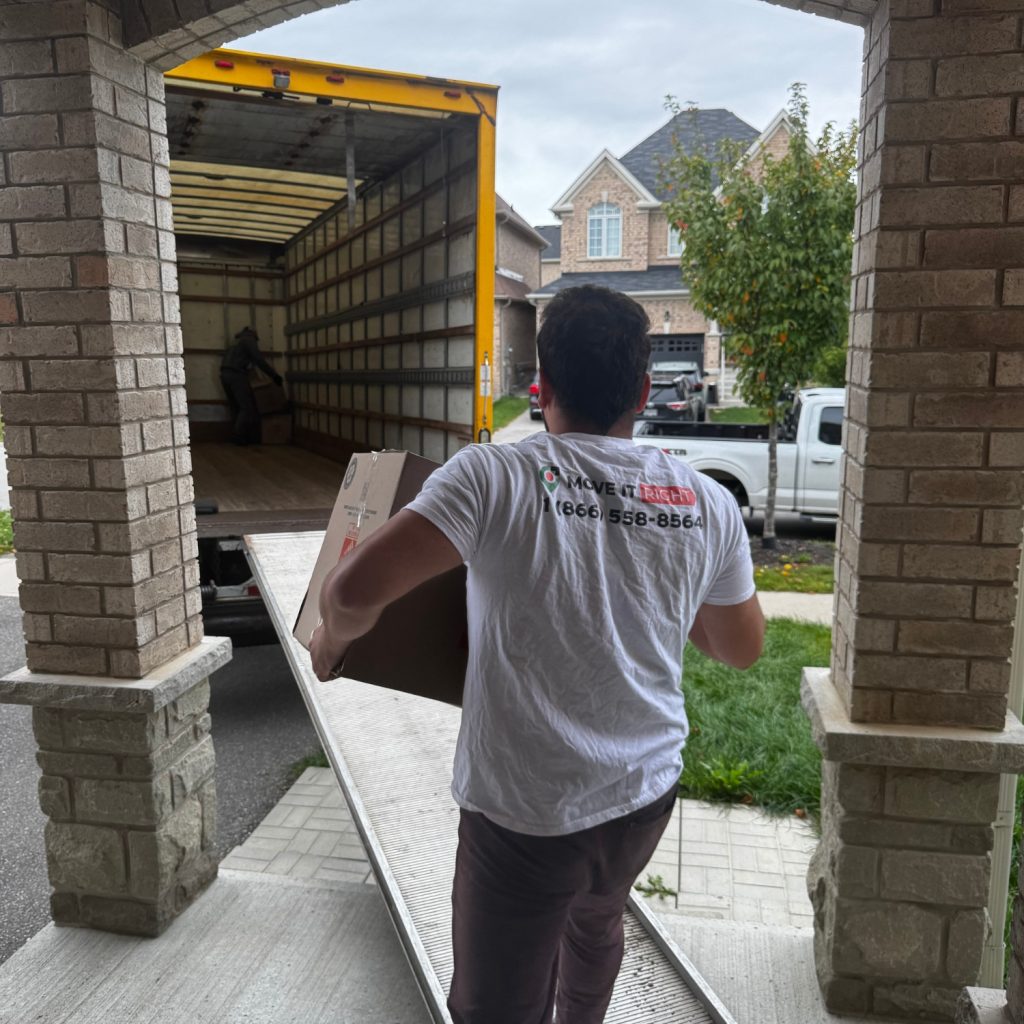 mover putting box into a truck