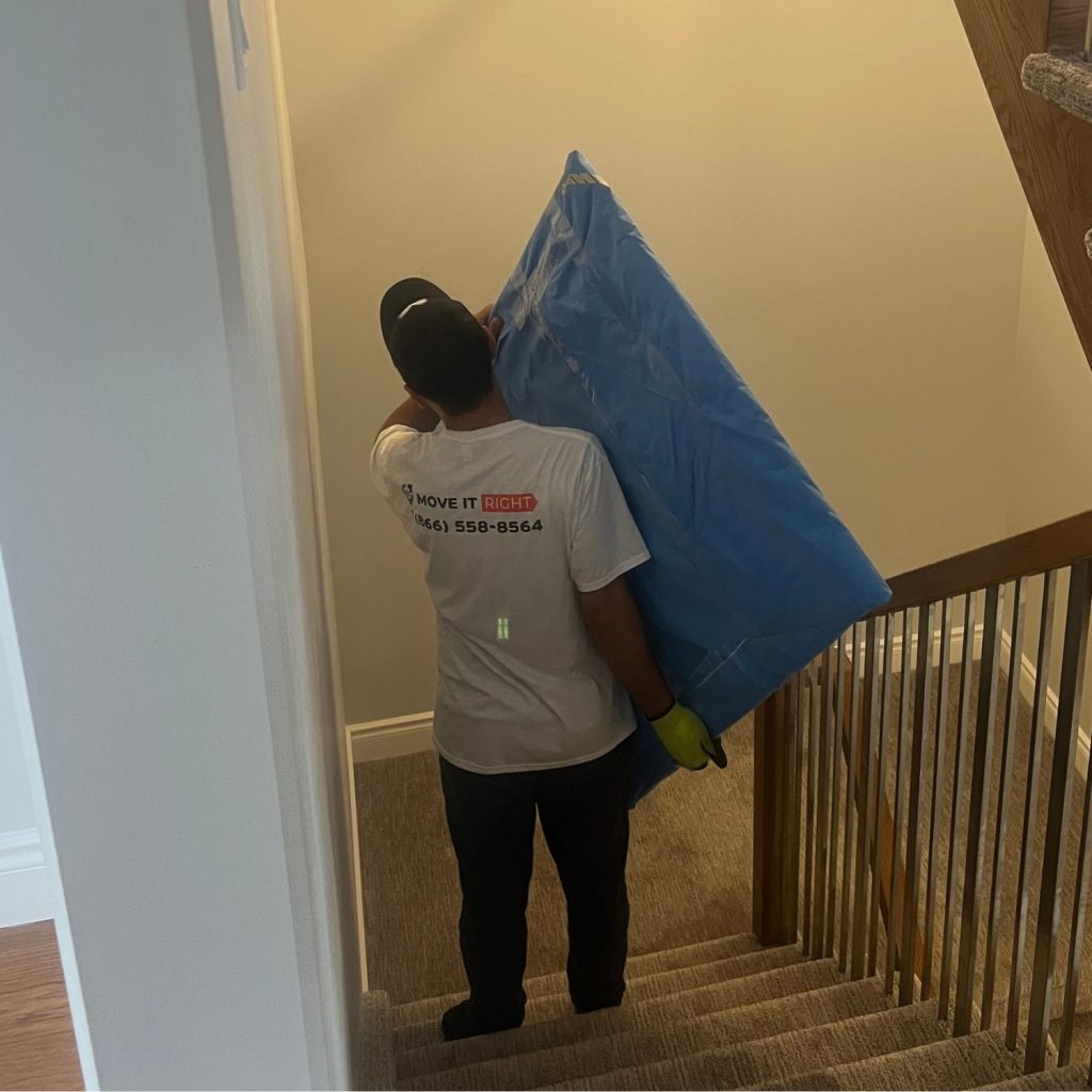 mover moving furniture in a home
