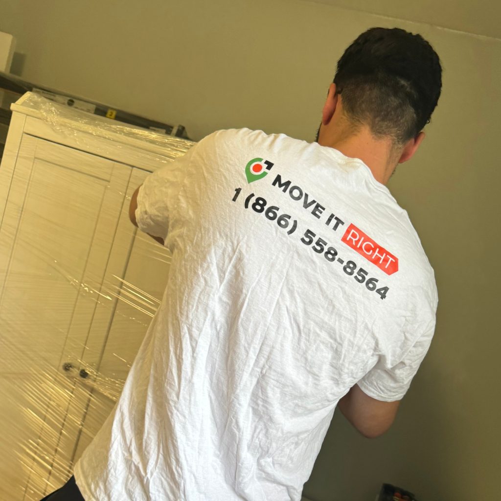 professional mover wrapping up furniture