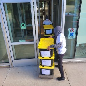 movers packing boxes in storage for long distance moving