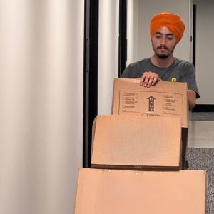 mover taking boxes to storage units