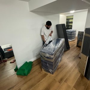 mover wrapping heavy furniture