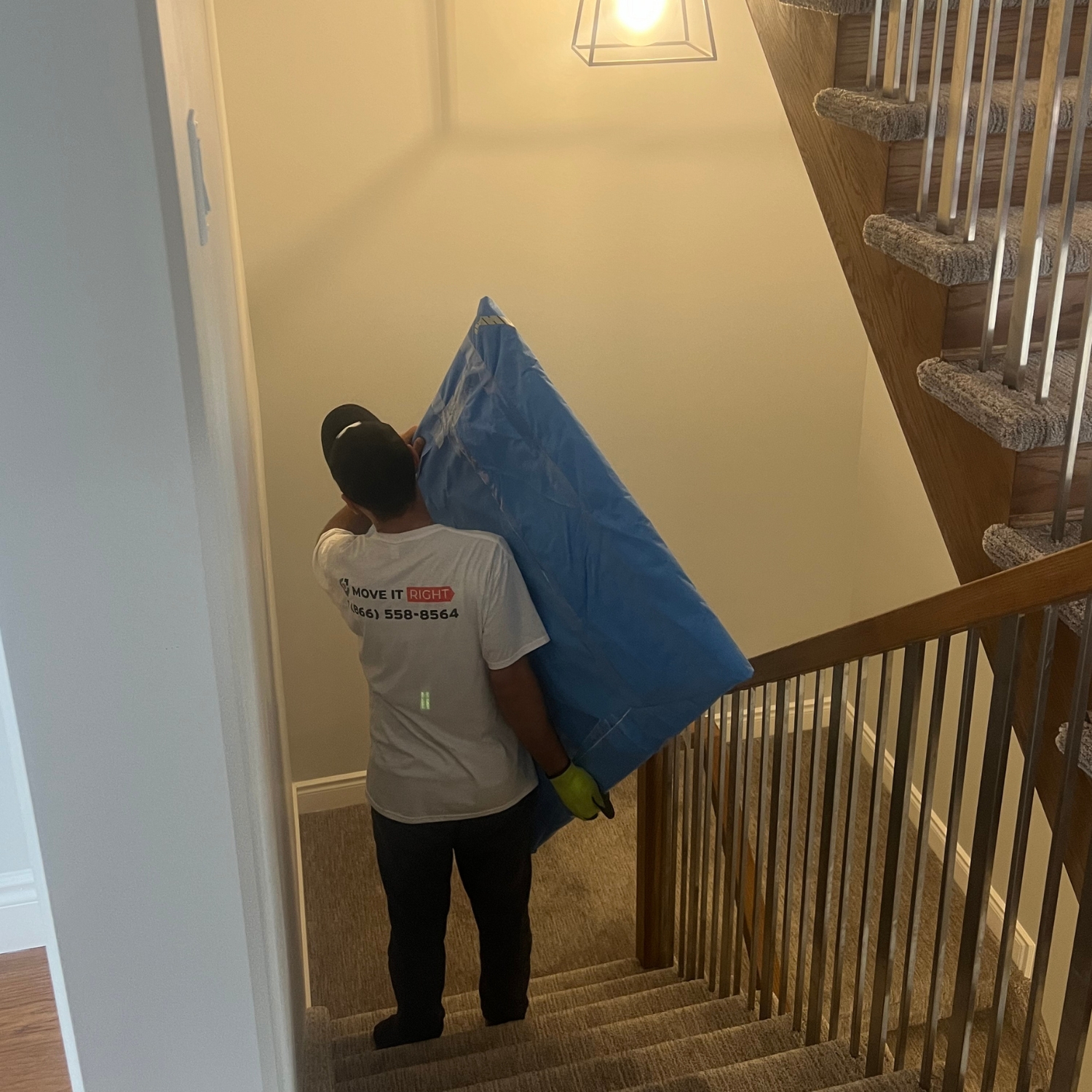 mover taking furniture downstairs