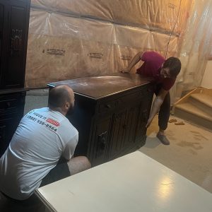 movers packing home furniture for a move
