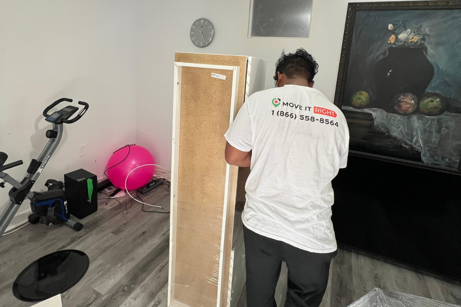 professional mover packing furniture in a home