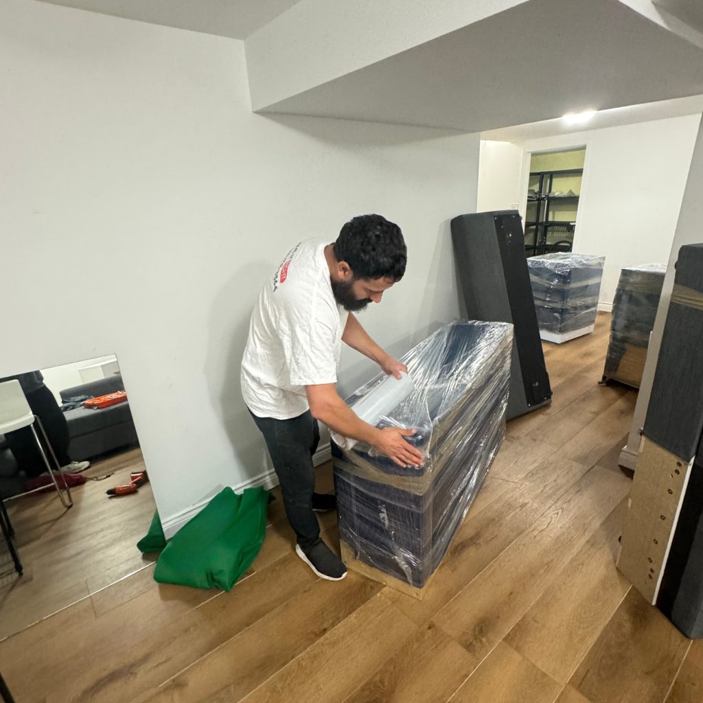 mover packing furniture and items for a long distance move