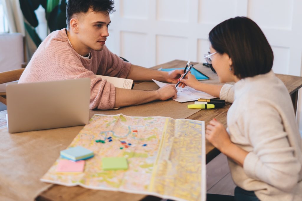 a couple planning and scheduling their moving services