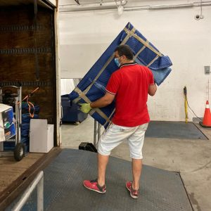 mover taking furniture out of secure storage unit