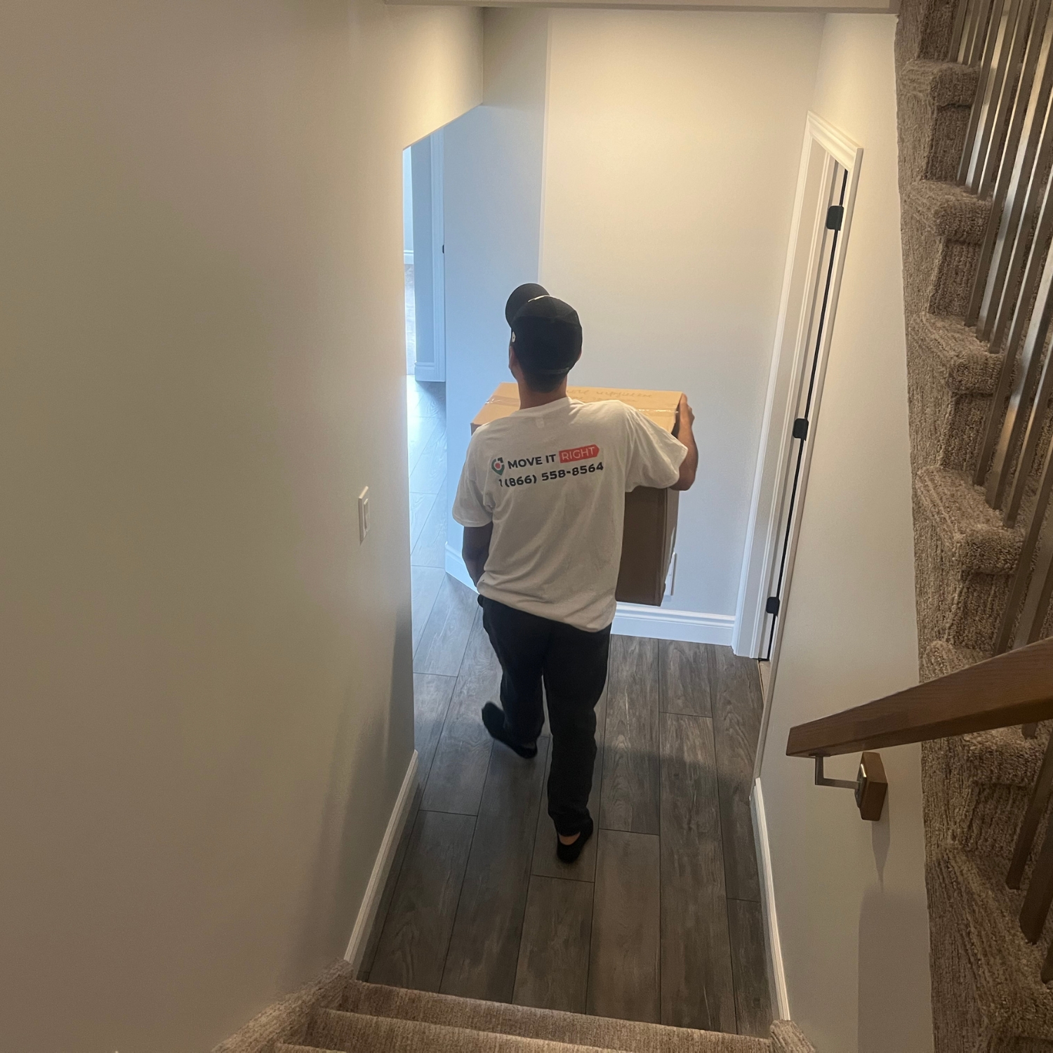 mover moving boxes out of home for long distance move