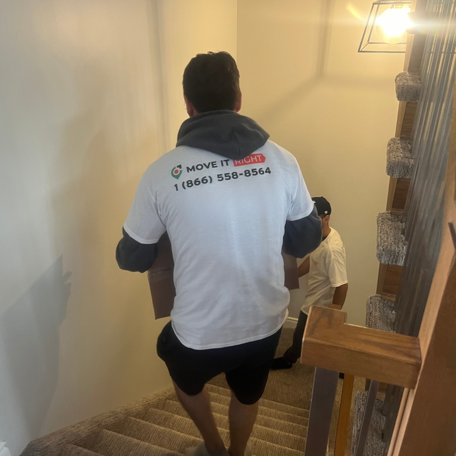 brampton movers taking boxes downstairs