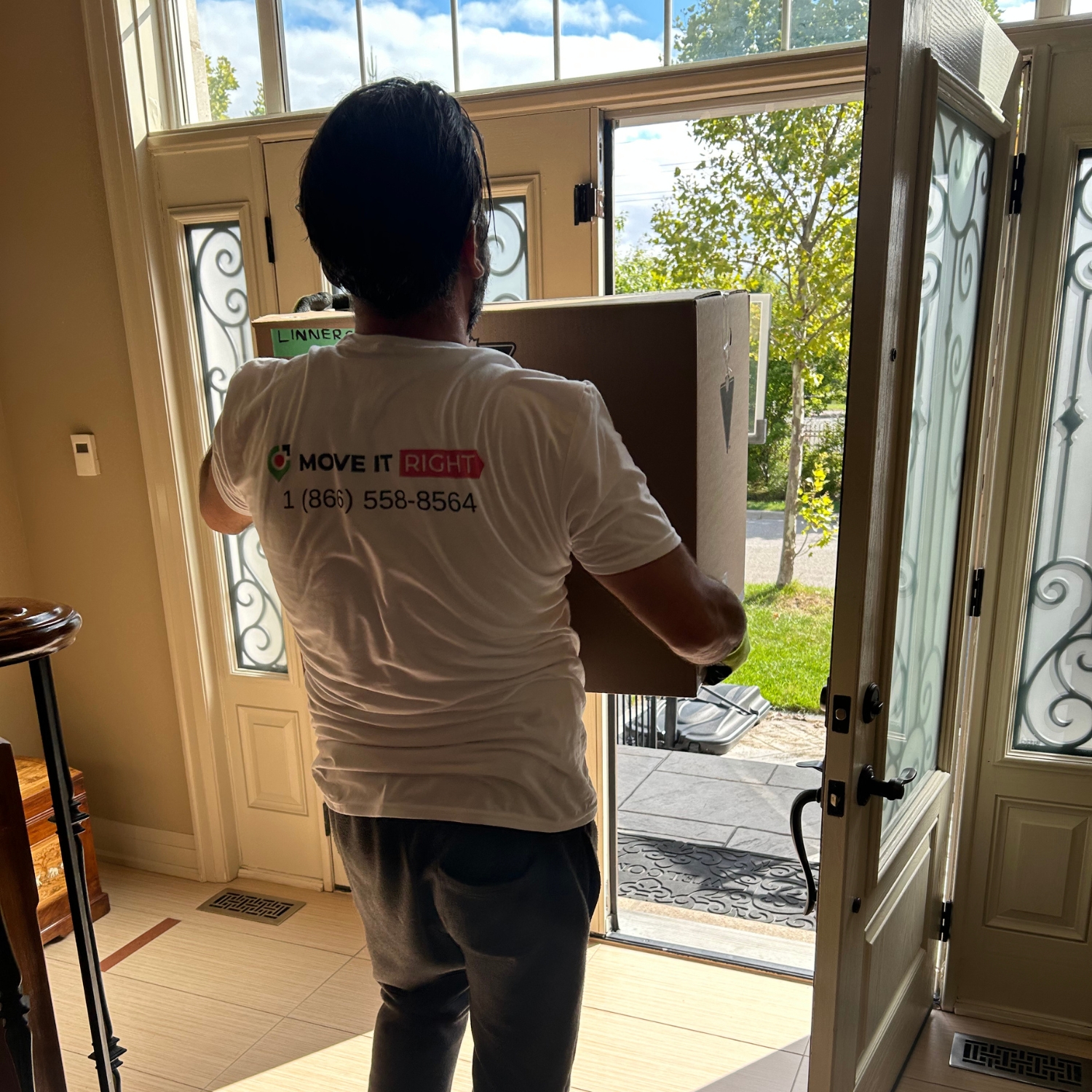 burlington moving company taking boxes out of a home