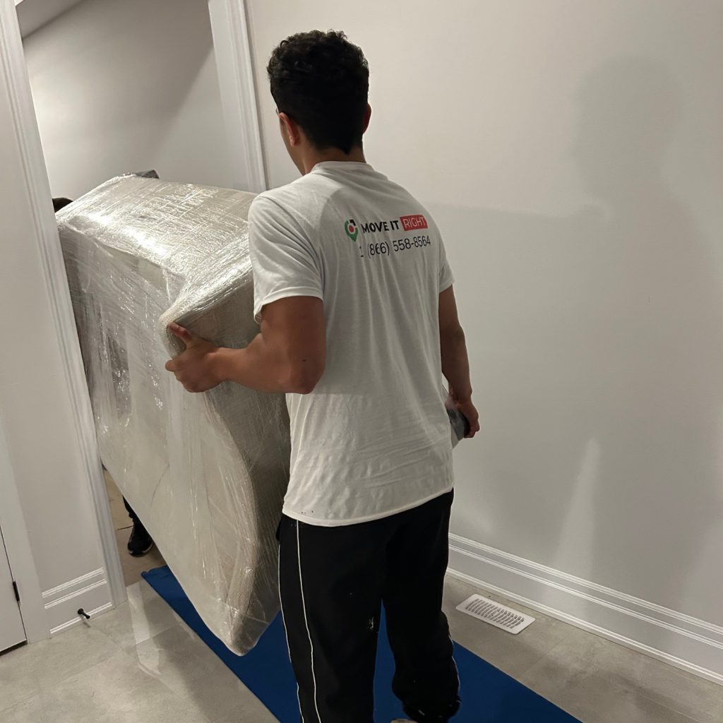 brampton moving services taking couch out of a room