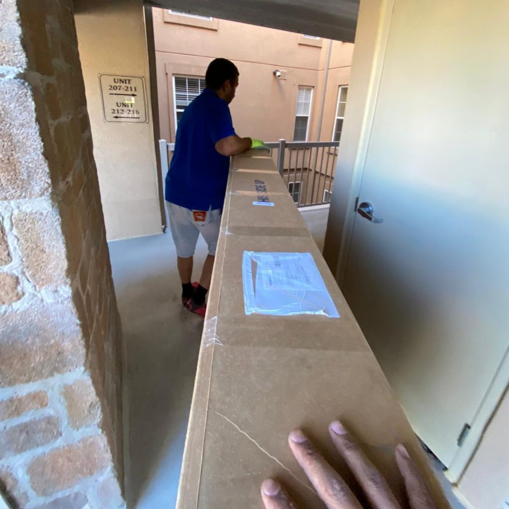 condo movers in a tight hallway