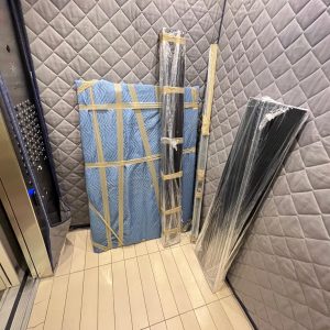 wrapped furniture in padded condo elevator