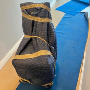 furniture wrapped in padding for apartment moving
