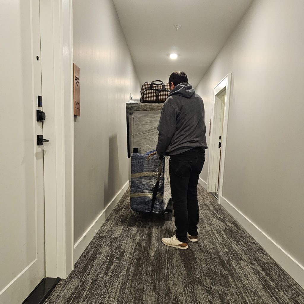 movers inside of condo hallway
