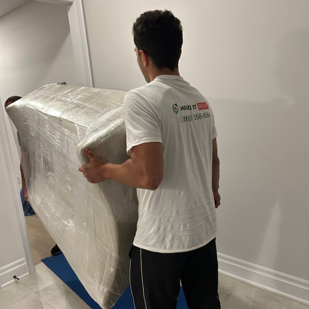 movers carrying heavy couch in ajax