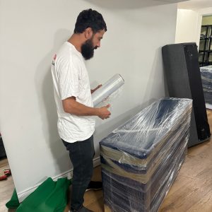 moving company wrapping insured furniture