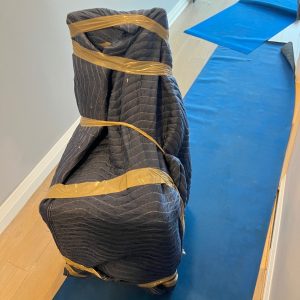 condo movers protecting floors, items, and walls