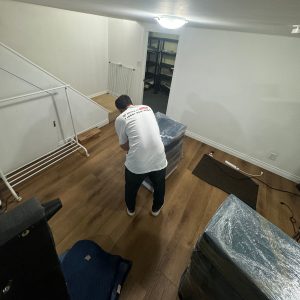 movers wrapping cabinet