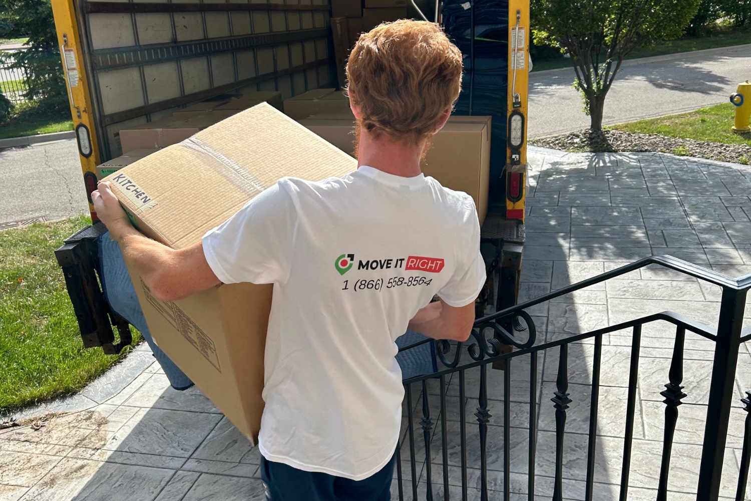 moving company loading boxes into trucks