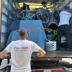 movers putting cottage furniture in the truck