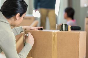 women labeling boxes