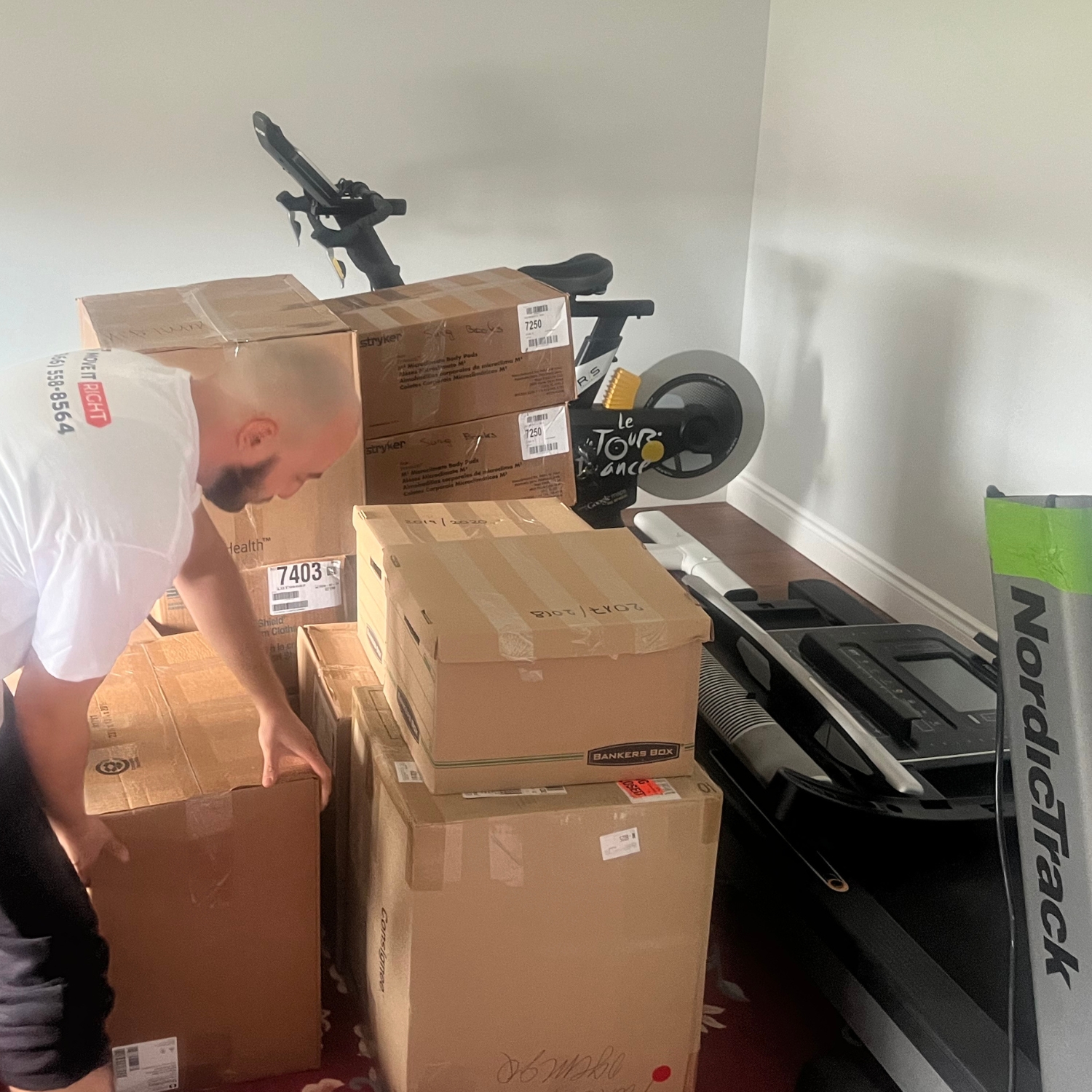mover packing up home gym equipment