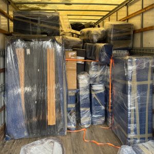 gym equipment packed away in moving truck