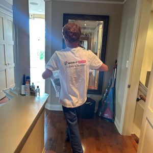 mover taking box out of a home