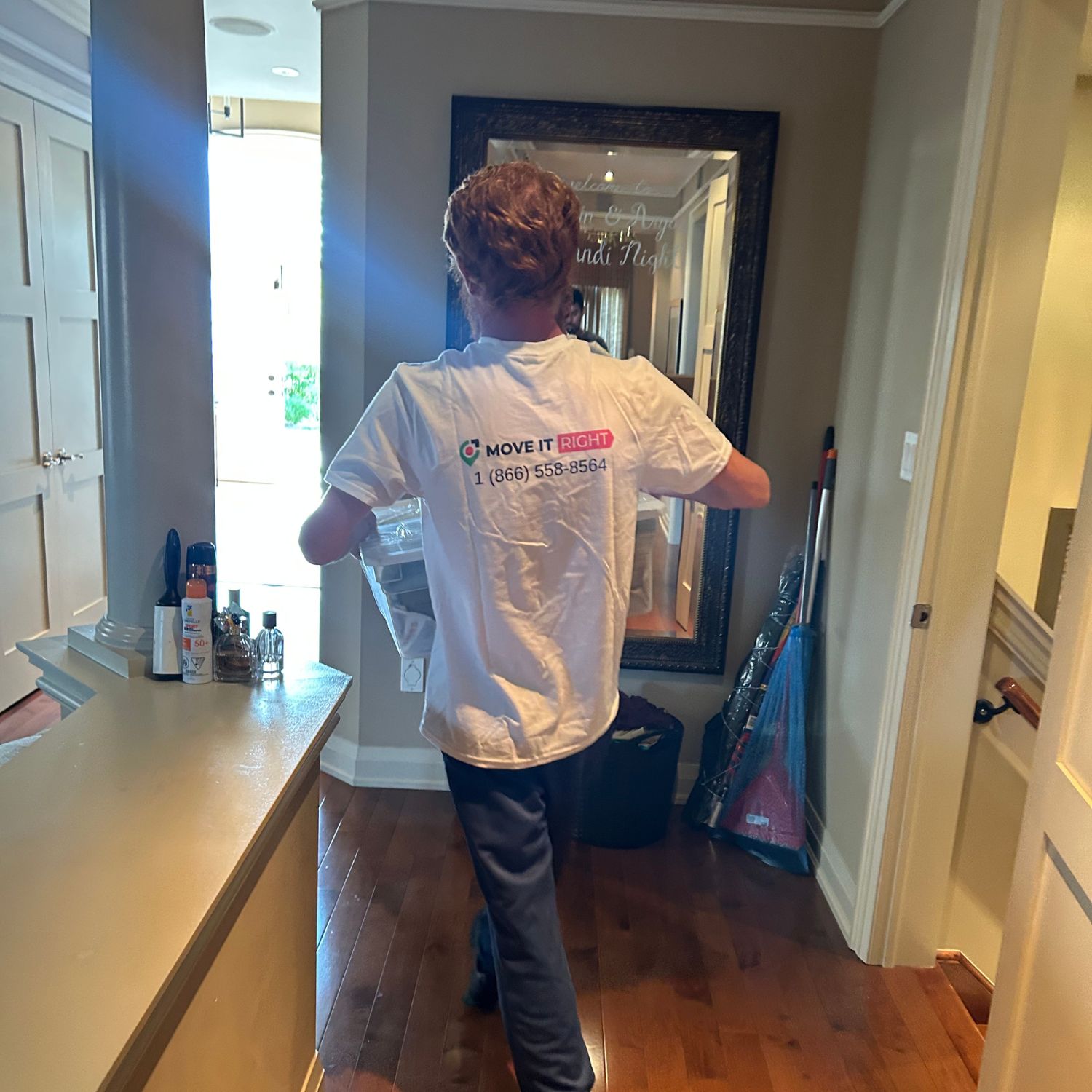 mover taking box out of a home