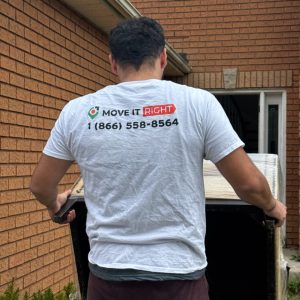 mover carrying furniture into home