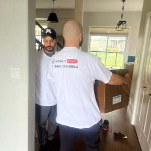 movers taking boxes in and out of home