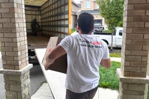 movers loading boxes into truck