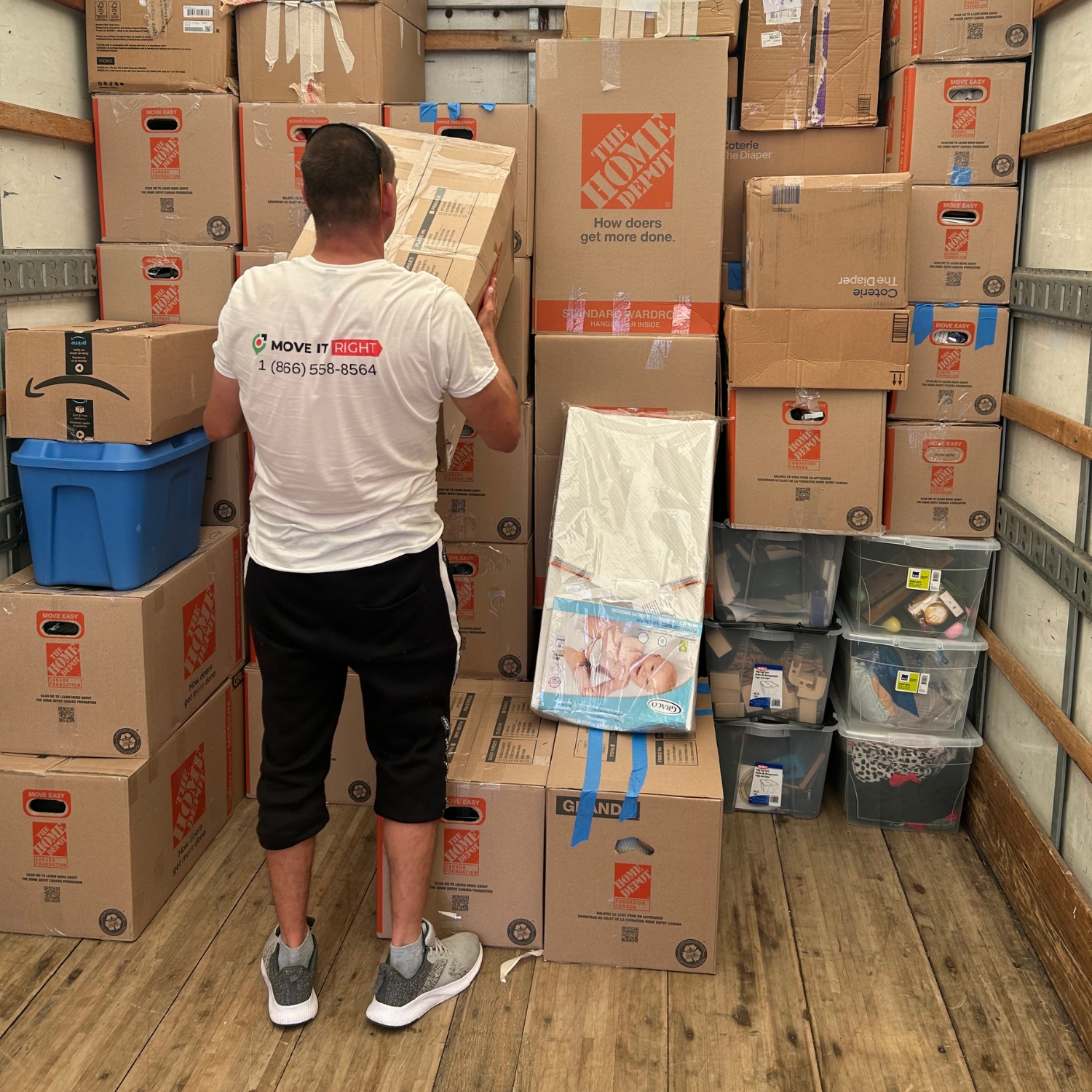 mover stacking boxes in truck