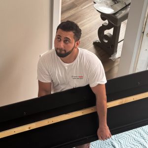 mover taking furniture up stairs