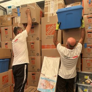 movers stacking boxes in truck