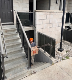 mover taking box out of markham condo