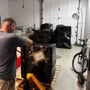 mover using lift to carry heavy equipment