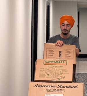 mover bringing boxes to load a truck