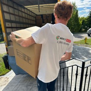 mover bringing boxes to truck