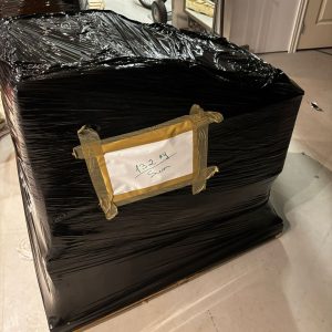 heavy equipment packed and padded with label for an office move