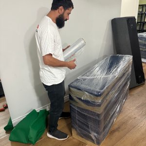 mover wrapping office furniture for a move