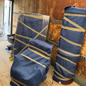 office furniture wrapped in moving company truck