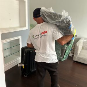 mover carrying office chair for a office move