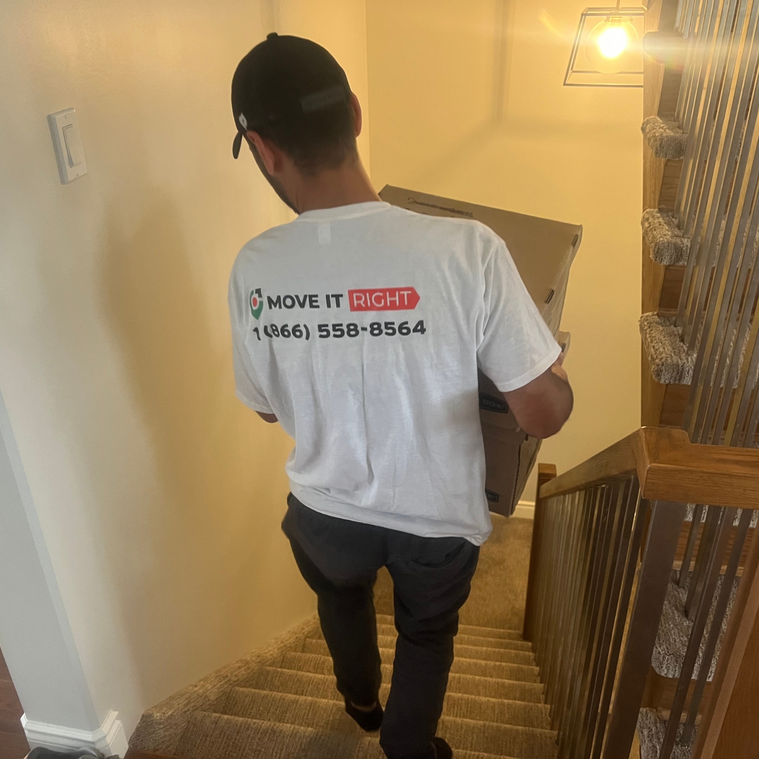 mover taking boxes down the stairs